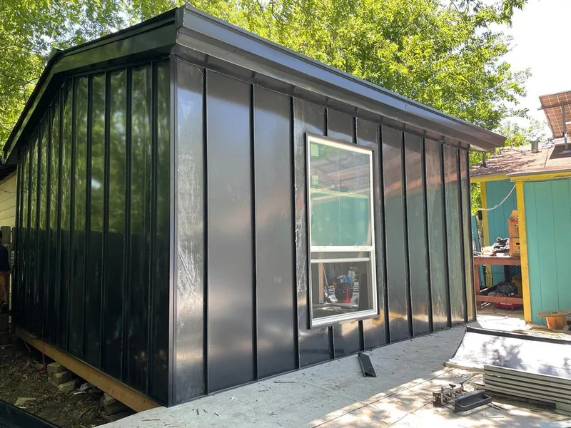Black standing seam metal wall panels for Roof Inspection in Mitchellville