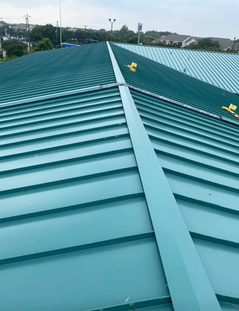 Green commercial metal roof ridge and valley for Metal Roof Repair in Mitchellville